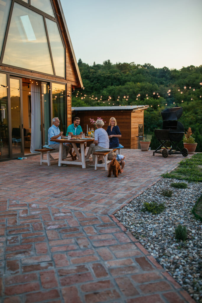 Family enjoying dinner together on their paver patio.